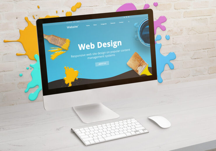 Concept of web design studio with coimputer display and color dr