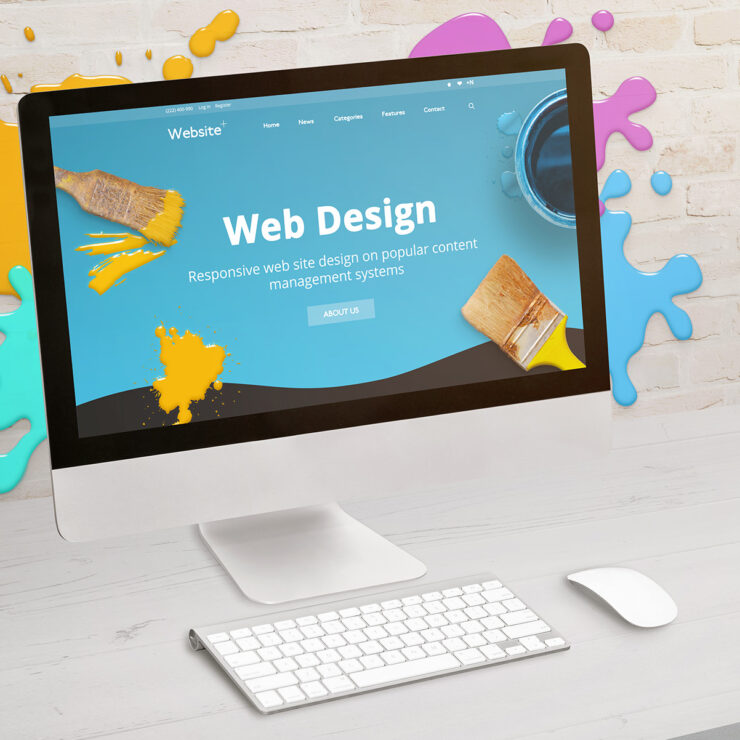 Concept of web design studio with coimputer display and color dr